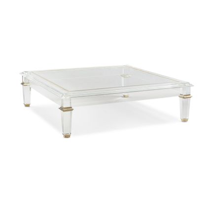 A simple yet sophisticated cocktail table by Caracole with beautiful brass detailing