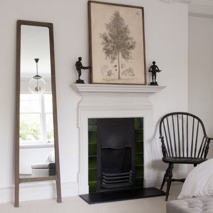 A floor standing dressing mirror crafted from recycled elm 