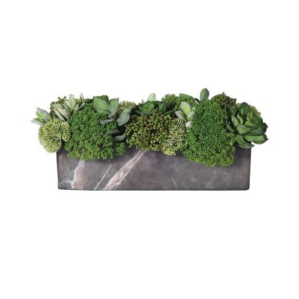 A beautiful, floral arrangement of faux skimmia and succulents in a grey faux marble pot