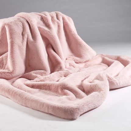 A luxurious soft pink faux fur throw with a barley colour faux suede reverse
