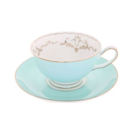 Elegant blue teacup with gold details and bird motif