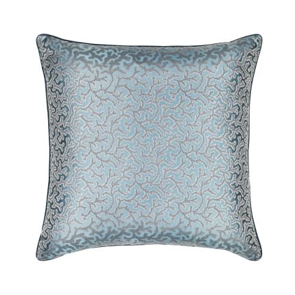 This luxurious, blue silk cushion features an elaborate, jacquard pattern with tailored piping along the edges. 