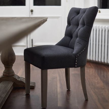 deep buttoned charcoal dining chair with studding