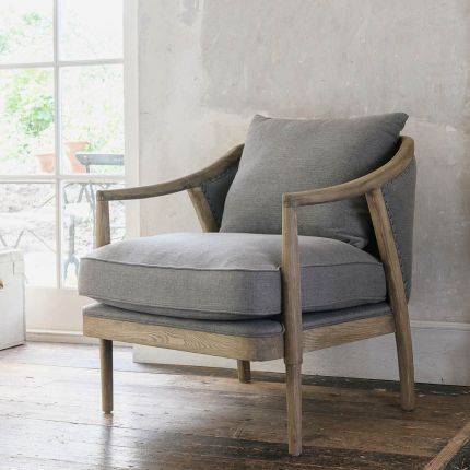 Grey linen armchair with curved oak frame