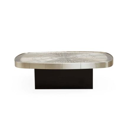 A gorgeous coffee table with a nickel plated top and a blackened base