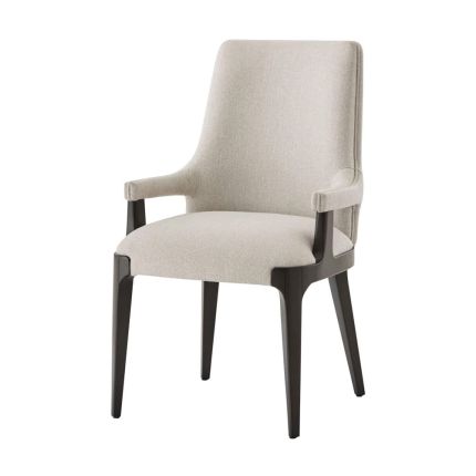 A stylish dining chair with a scooped back, padded seat, tapered legs and a gorgeous grey upholstery 