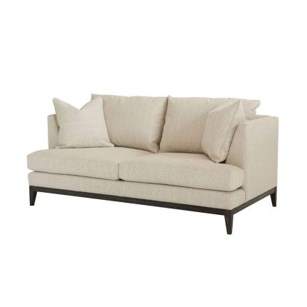A modern sofa with a neutral linen upholstery and complementary scatter cushions