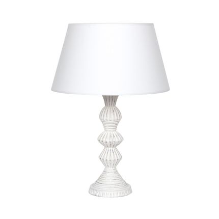 Shapely, distressed finish table lamp