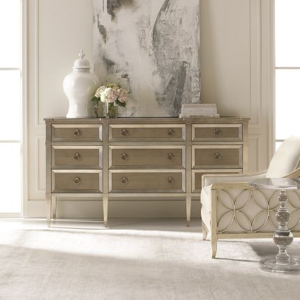 A sophisticated dresser by Caracole with jewellery-like hardware and nine spacious drawers