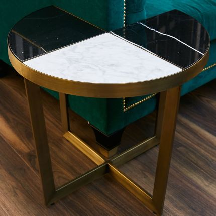 Stylish brushed brass side table with a black and white marble tabletop