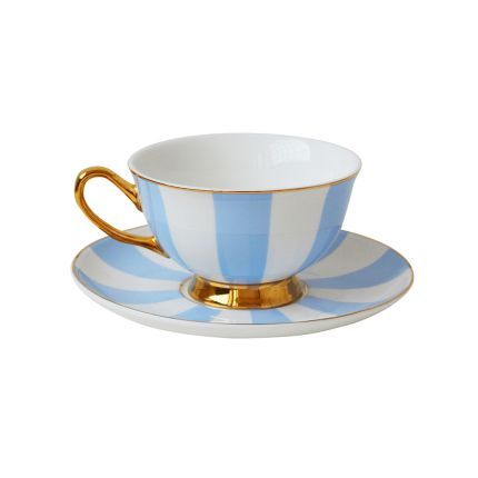 A chic blue and white striped teacup and saucer with golden accents