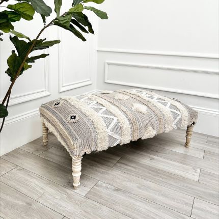 A stylish Aztec stool crafted from cotton, wool and mango wood