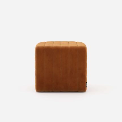 Luxury velvet pouffe with padded, ribbed design