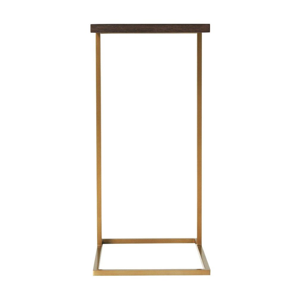A luxury end table with a brushed brass base and walnut coloured table top