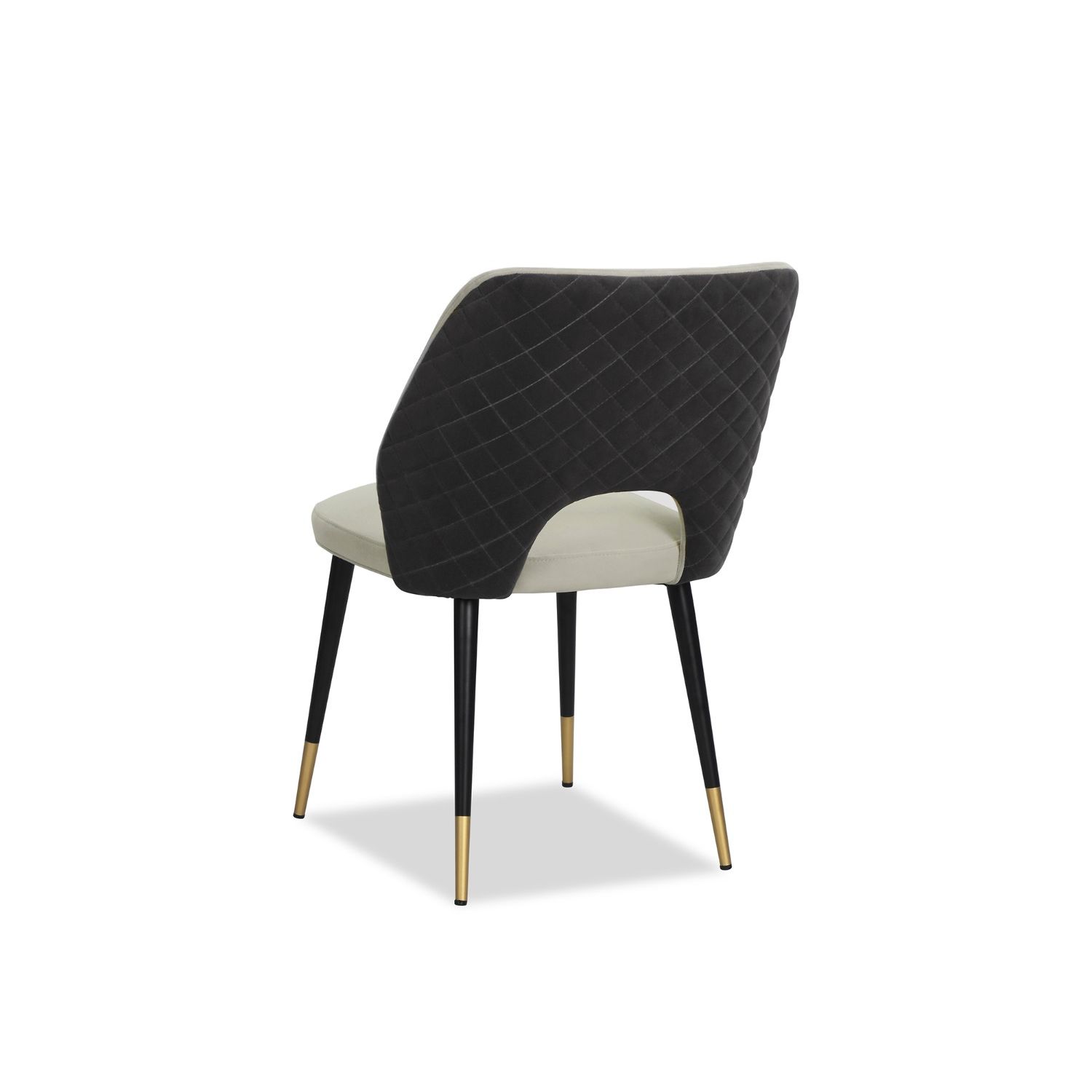 Elegant dining chairs with light grey velvet upholstery and quilted dark grey back