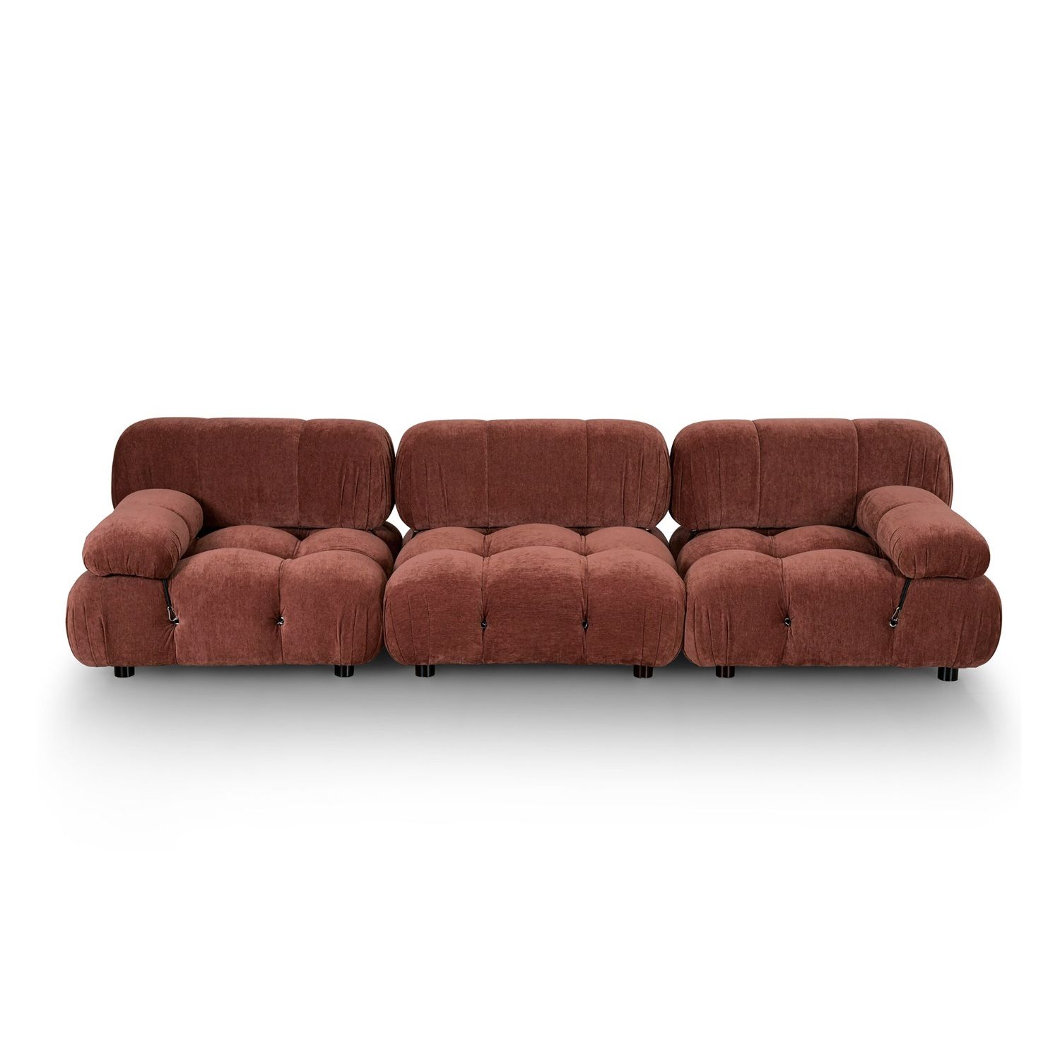 A statement modular sofa with a stylish rust upholstery and deep buttoned design