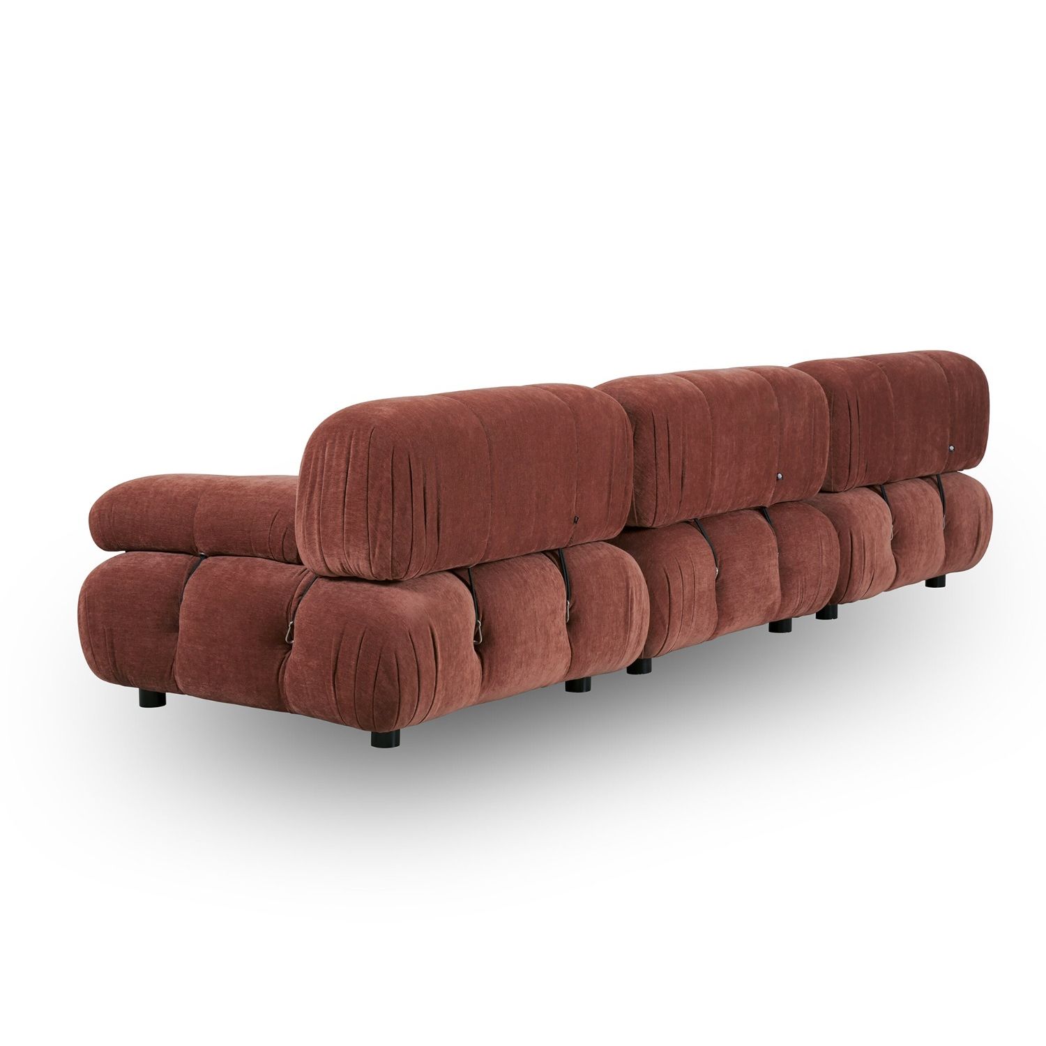 A statement modular sofa with a stylish rust upholstery and deep buttoned design