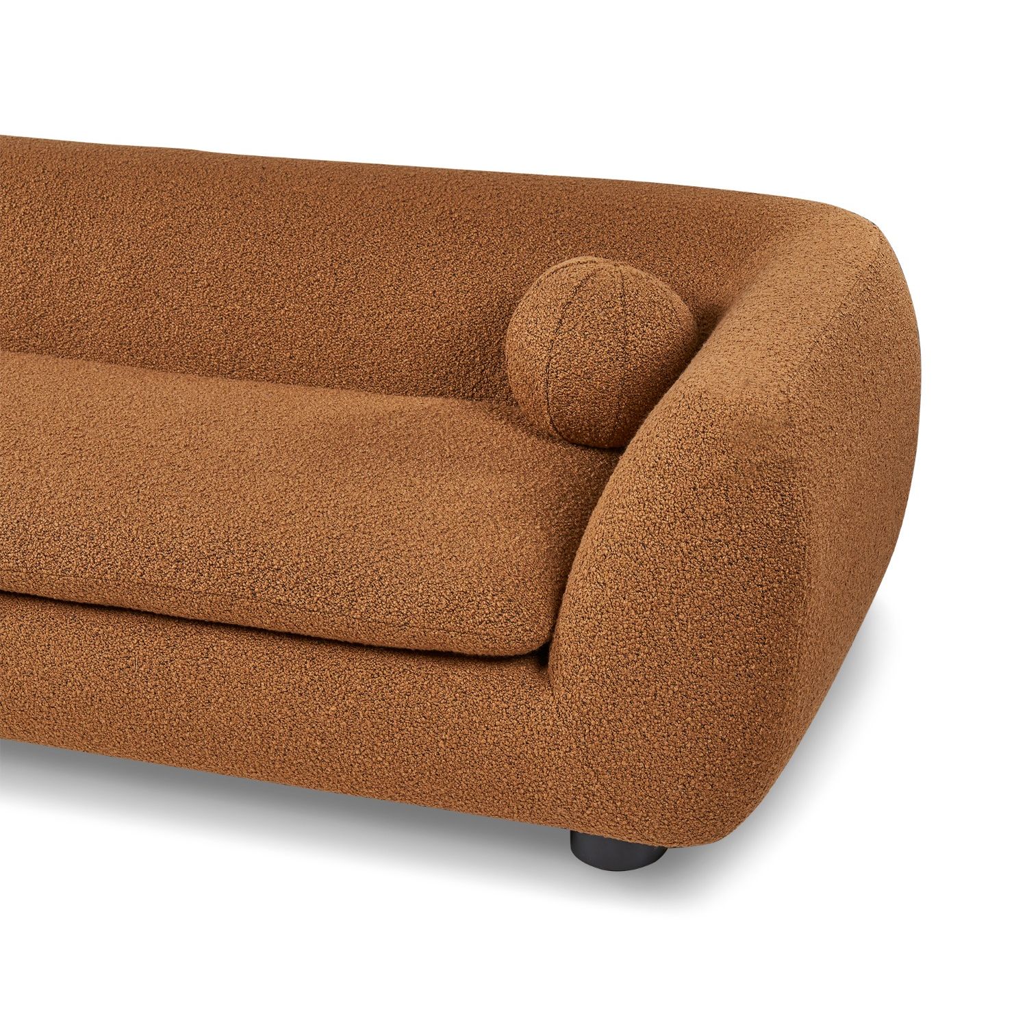 A stylish sofa with two ball scatter cushions and a beautiful boucle upholstery