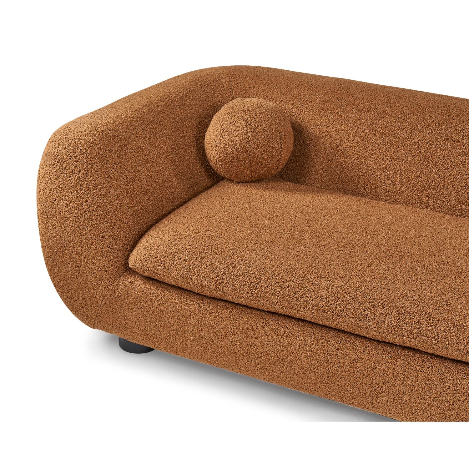 A stylish sofa with two ball scatter cushions and a beautiful boucle upholstery