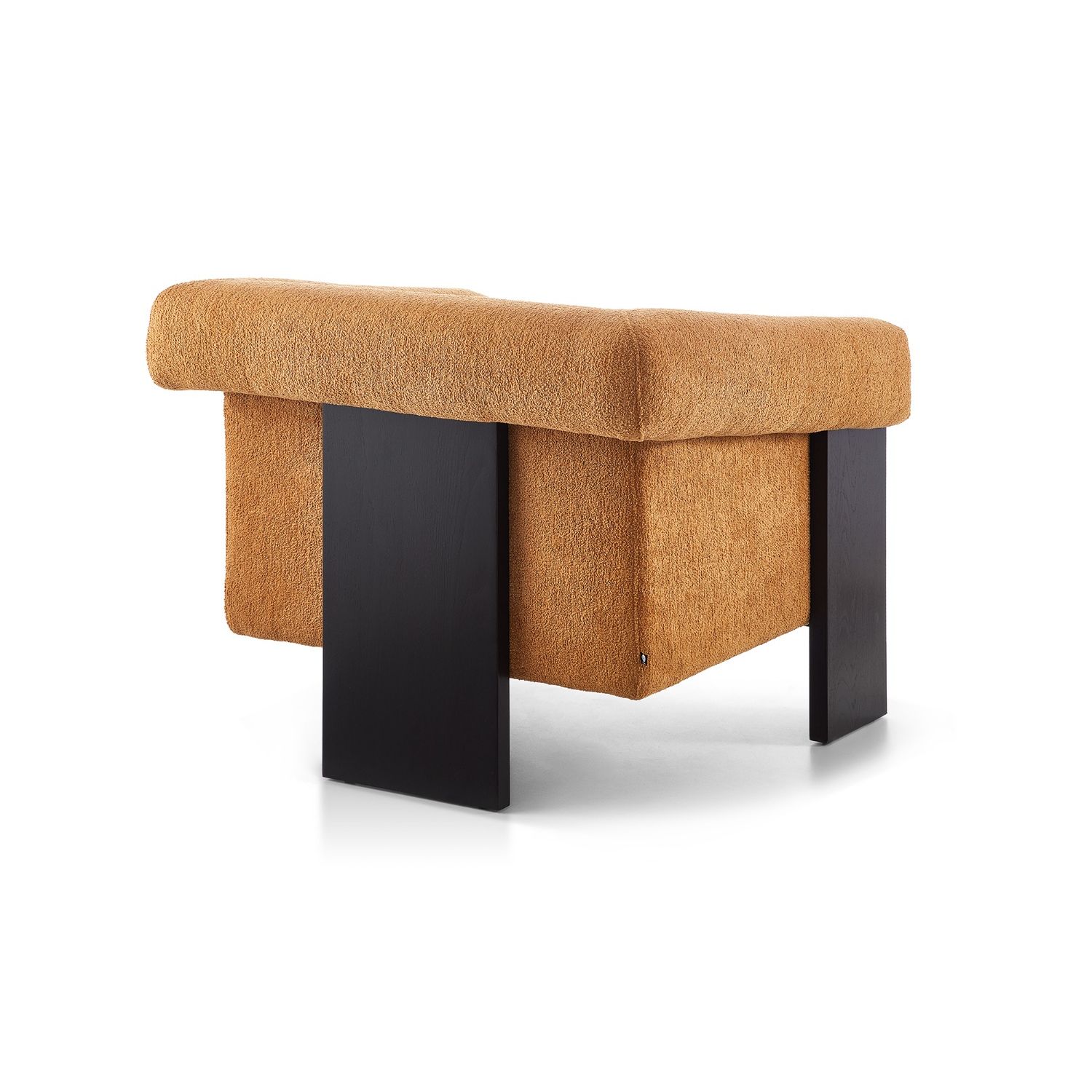 A statement armchair with a bright upholstery and black wood finish