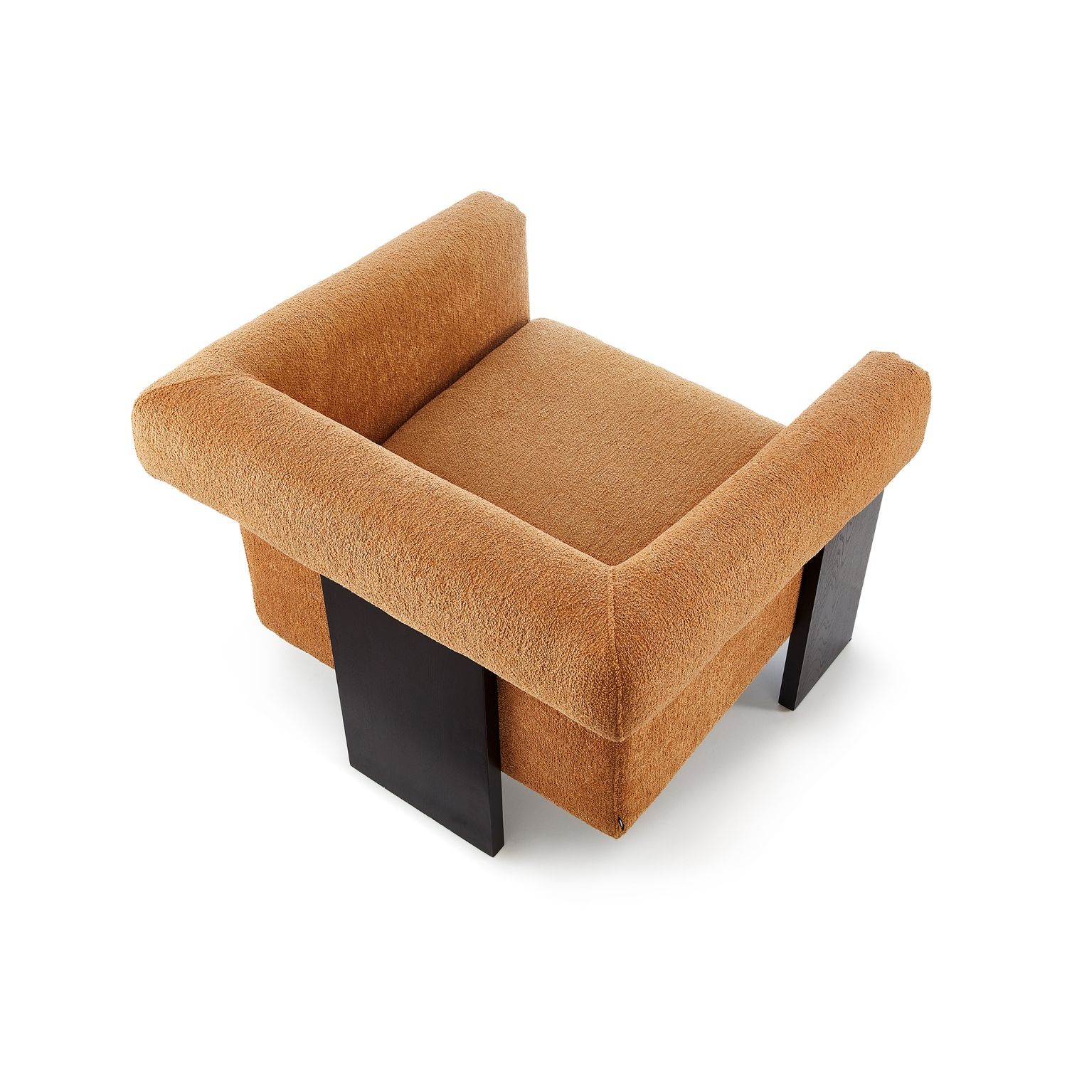 A statement armchair with a bright upholstery and black wood finish