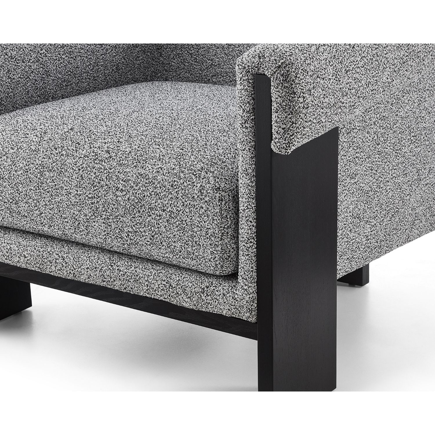 A contemporary chair with a gorgeous grey upholstery and black wood finish