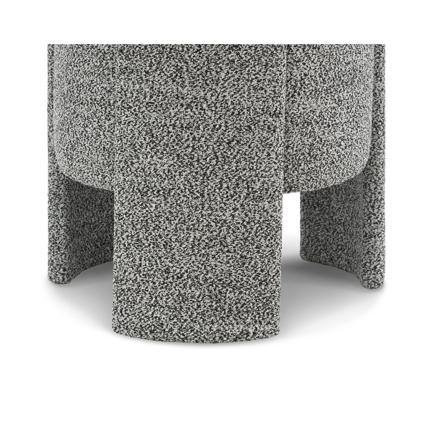 Small round stool upholstered in speckle grey fabric with wide legs overlapping the seat