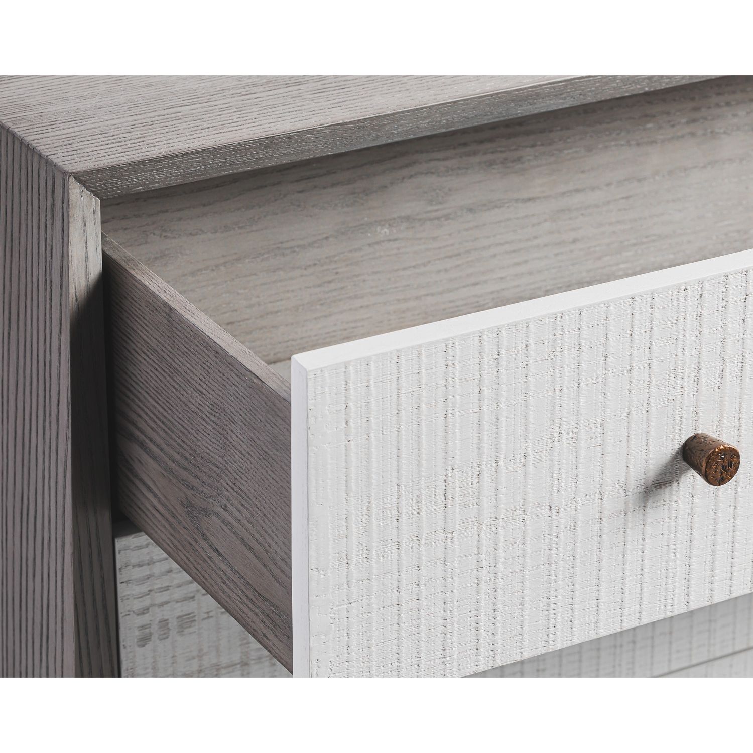 A luxury chest of drawers with a grey and white wood finish