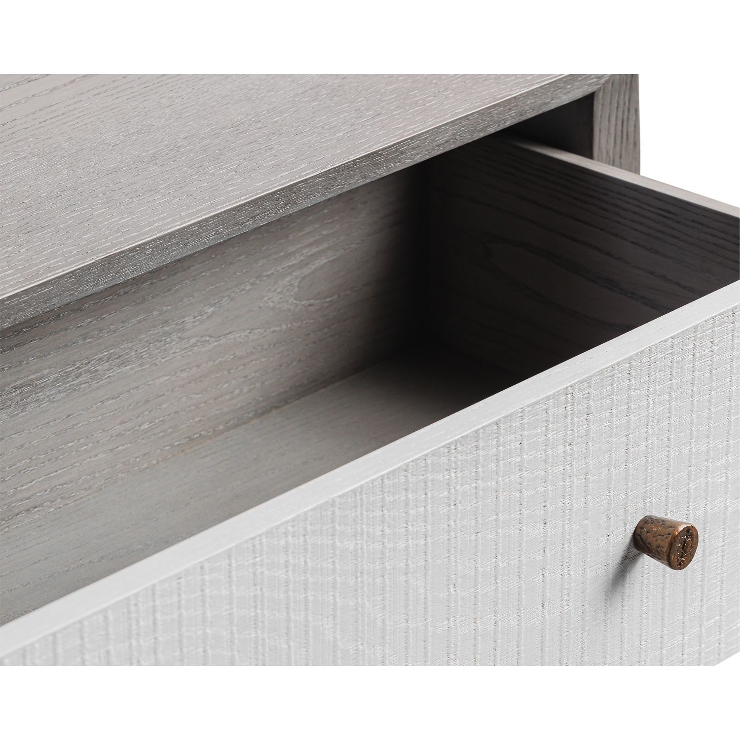A luxury chest of drawers with a grey and white wood finish
