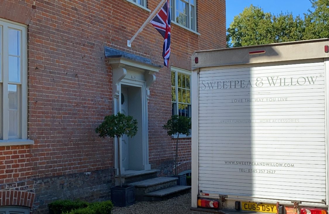 outside the doorway of a luxurious home