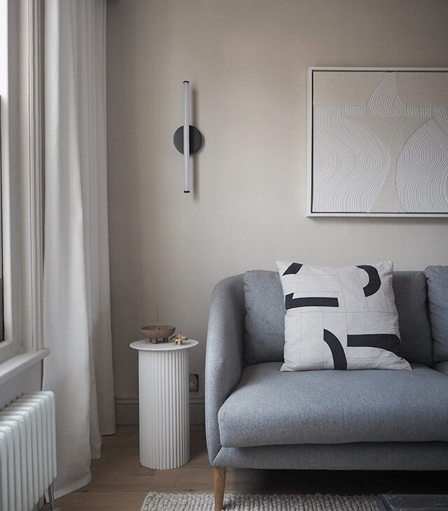 a minimalist grey-scale living room